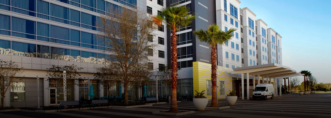 palm trees in front of a building