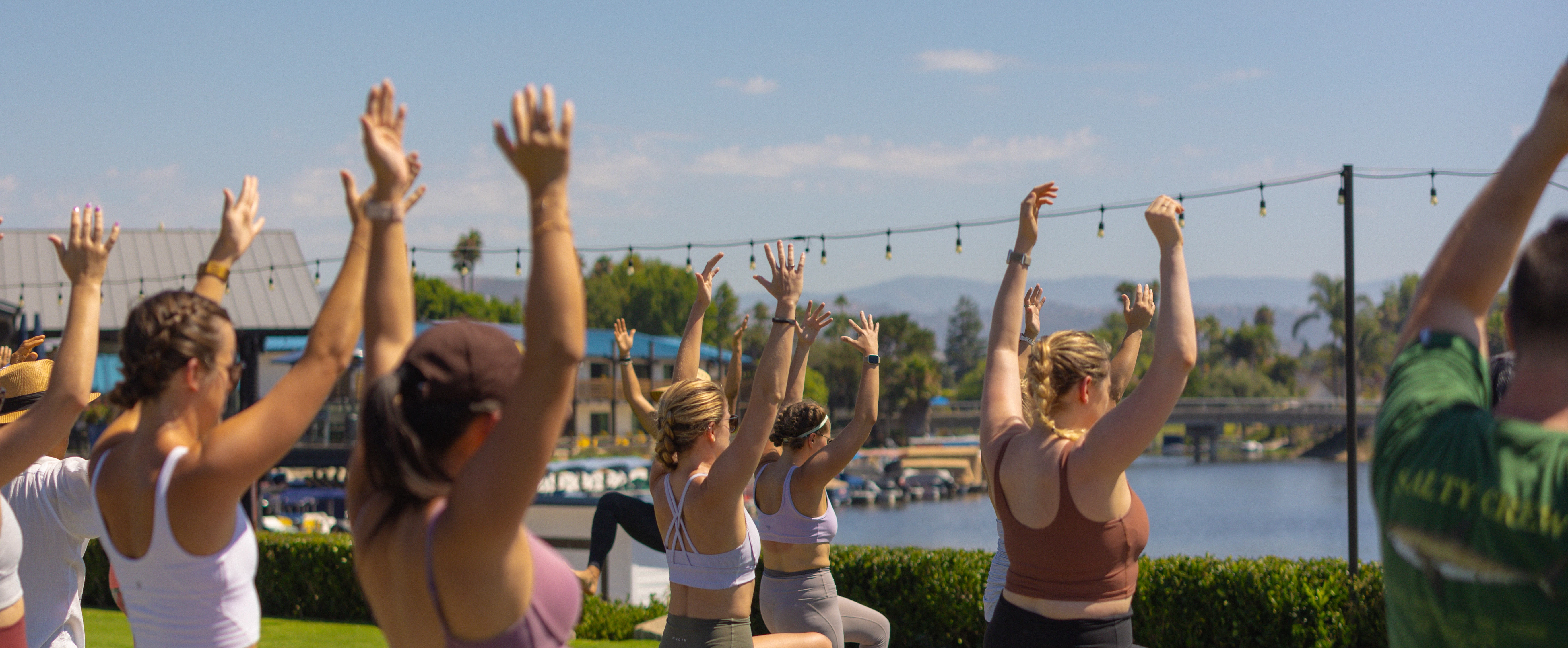 a group of people doing yoga outside