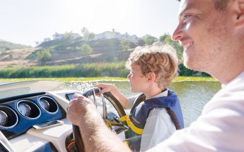 a man and child on a boat