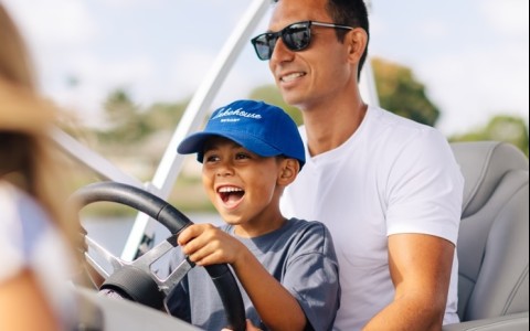 a man and boy in a boat