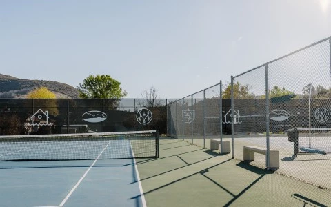 a tennis court with a fence