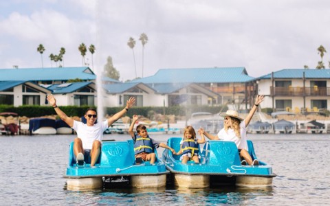 a group of people on a pedal boat