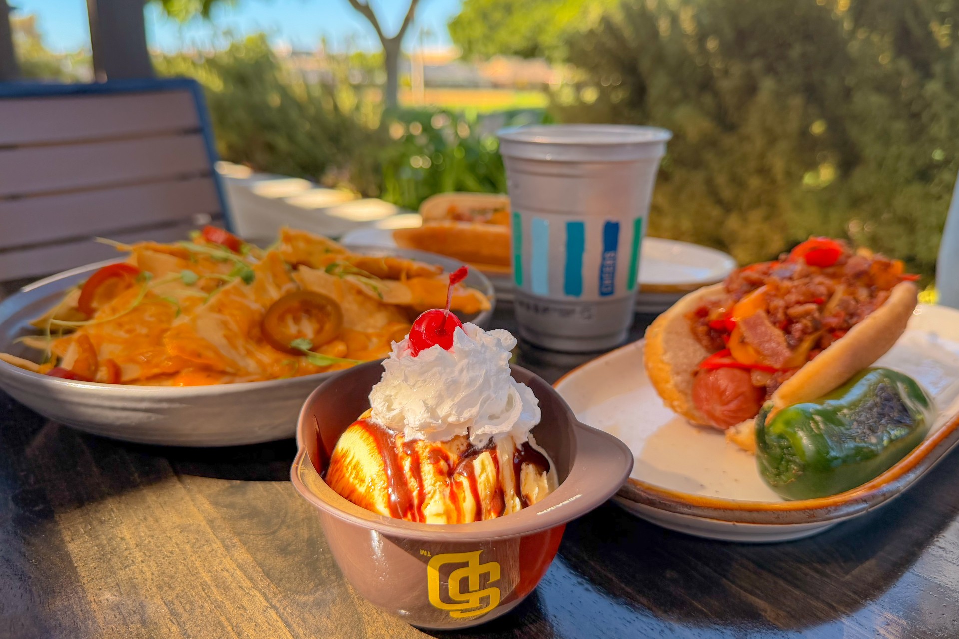 a table with plates of food and drinks