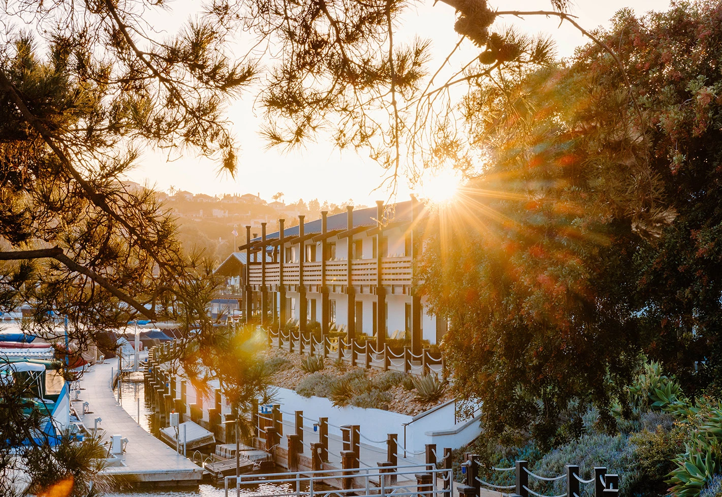 a building with a large archway and trees around it