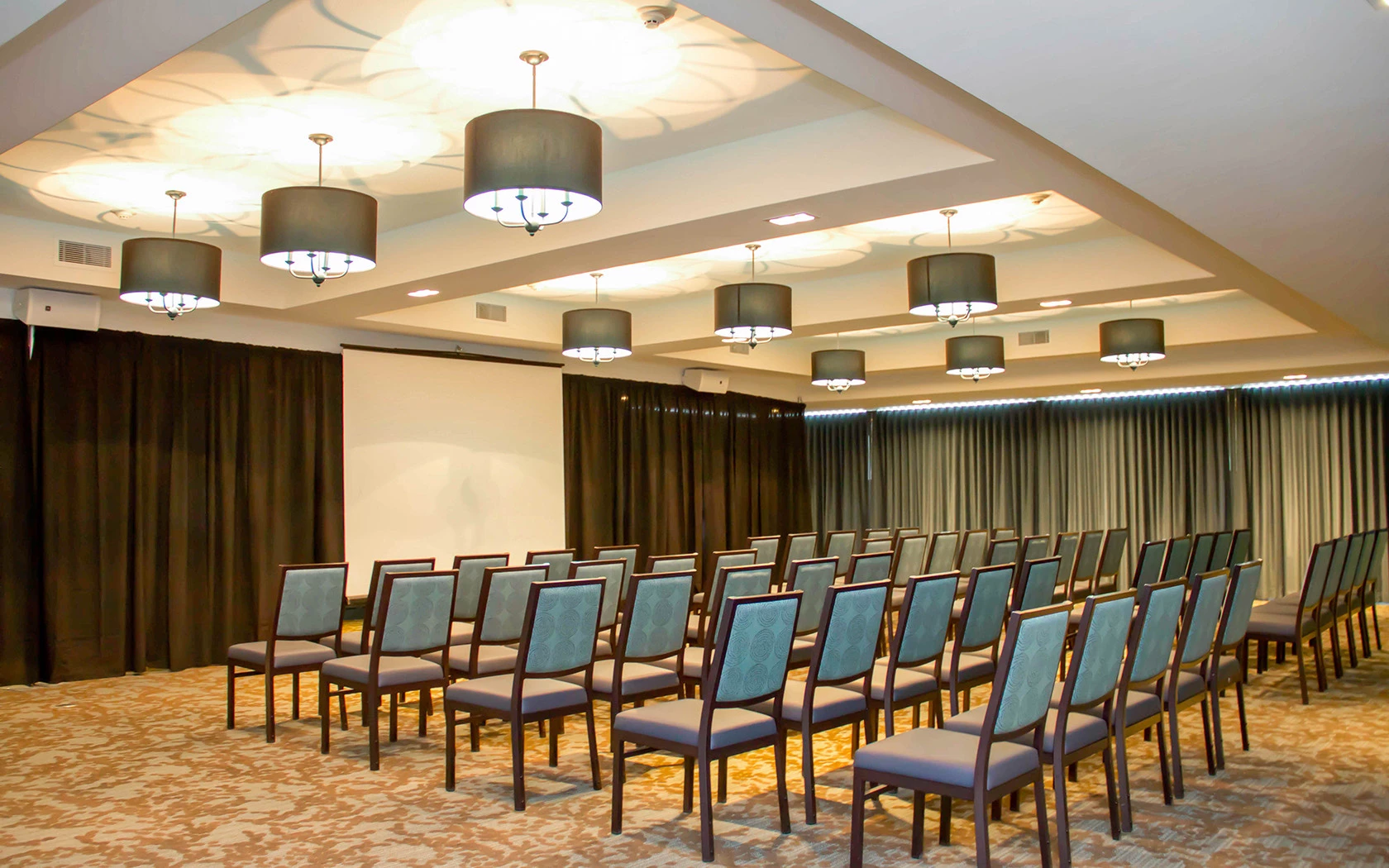 a room with chairs and lights