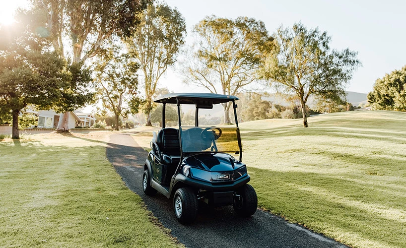 a golf cart parked on a driveway