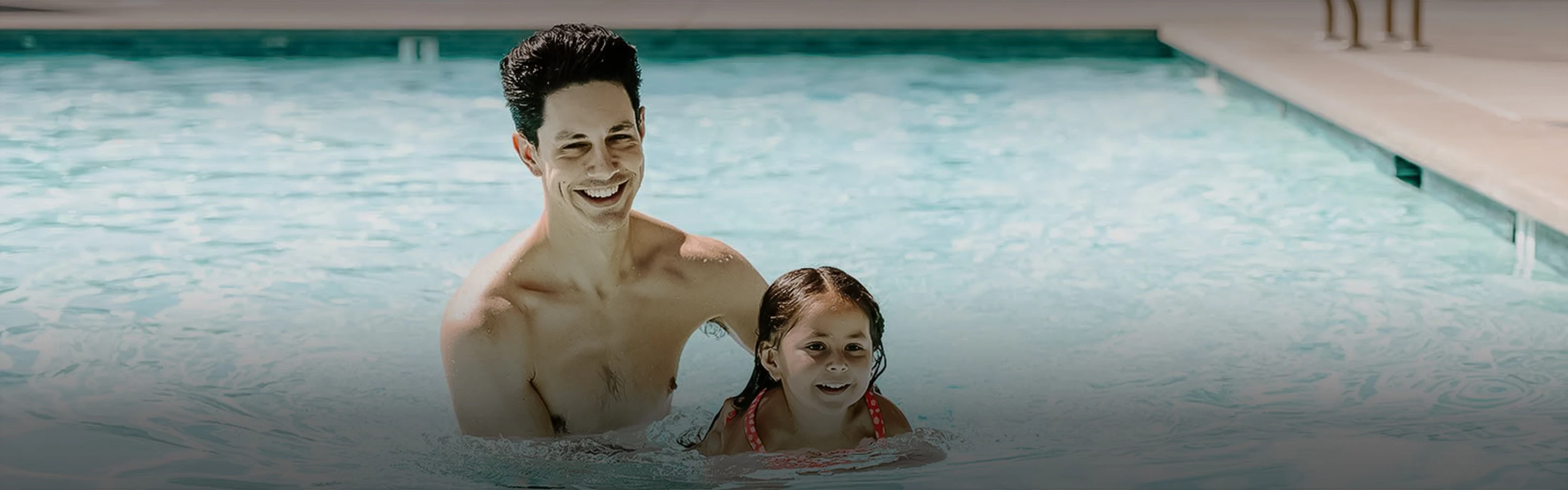 a man and a woman in a pool