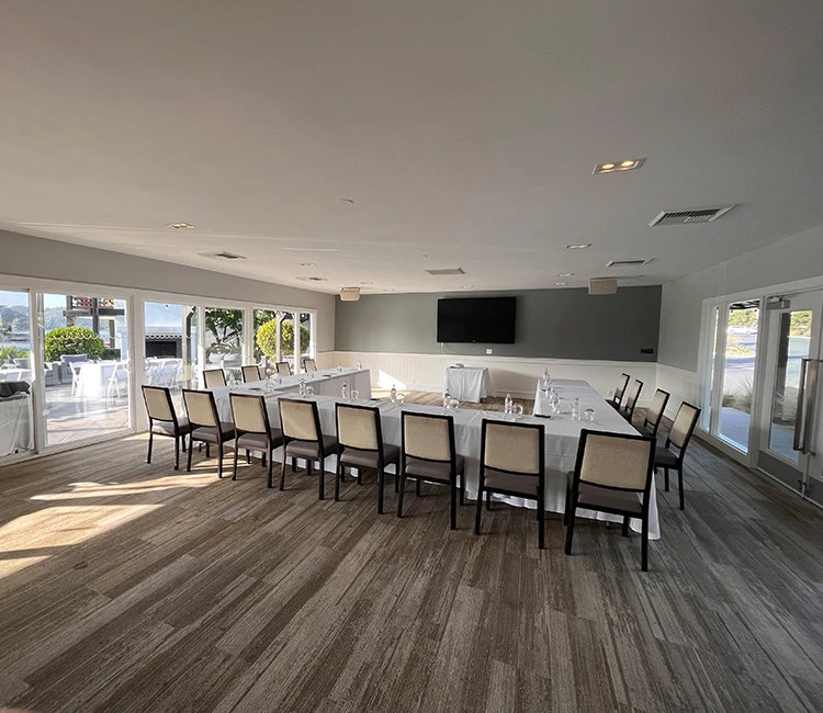 a large dining room with a large table and chairs