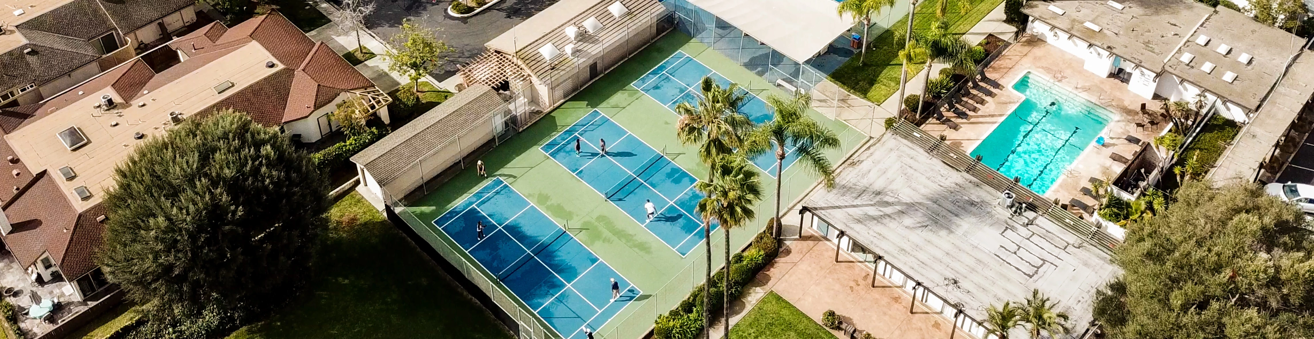 a tennis court with people on it