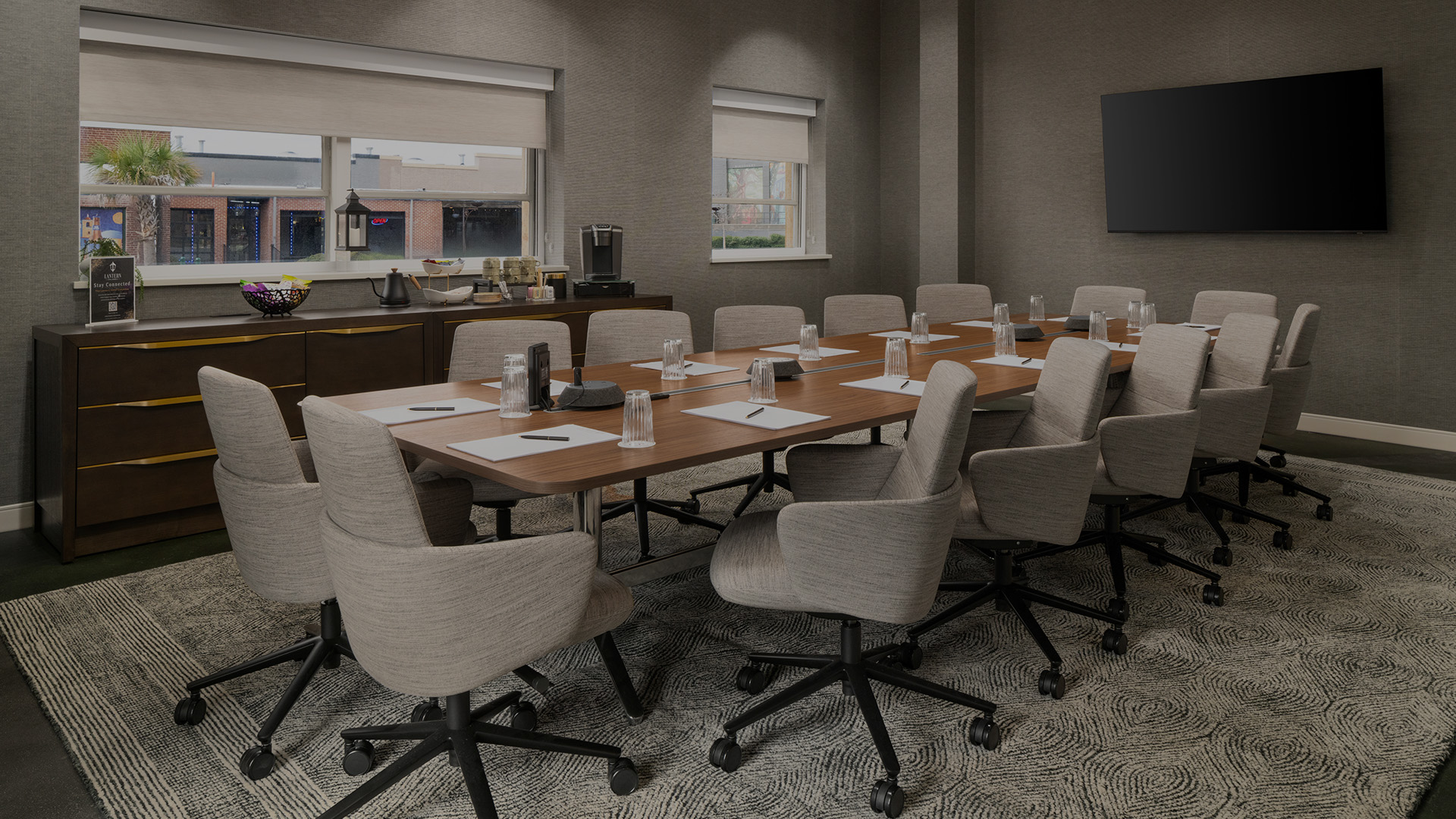 a conference room with a table and chairs