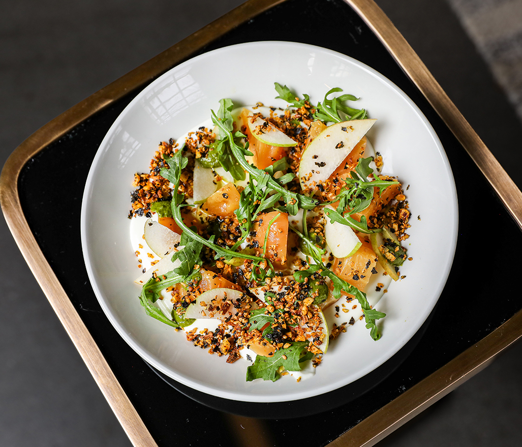 a plate of salad on a tray