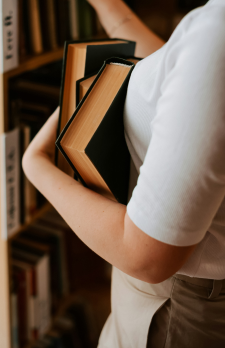 a person holding books
