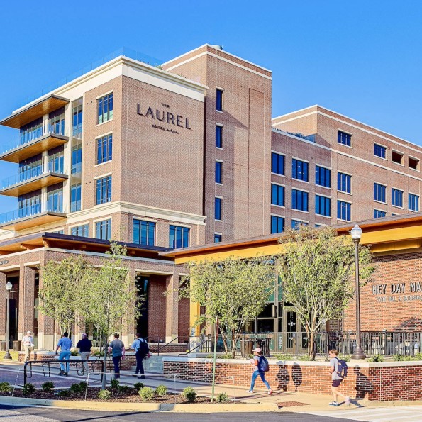 a building with people walking in front of it preview