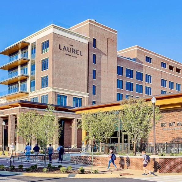 a building with people walking in front of it preview