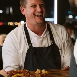 chef serving guest appetizers 