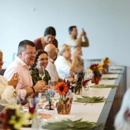 guest enjoying wine and taking pictures of the cooking class