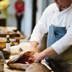 chef cutting and filet fish