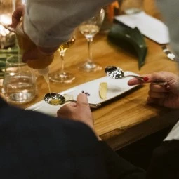 a chef serving a bite size presentation 