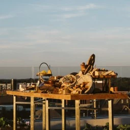 appetizer table on the rooftop at sunset