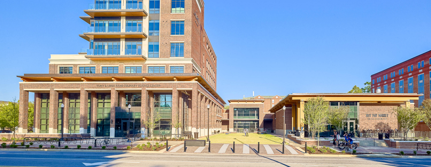 a building with a lawn and grass