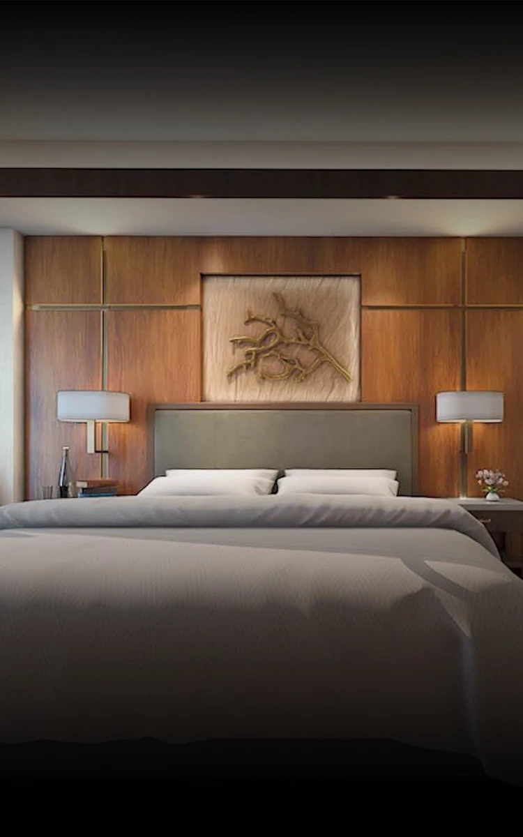 a bed with a wood paneled wall and a picture above it