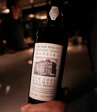 fancy bottle of wine with with a black and white label