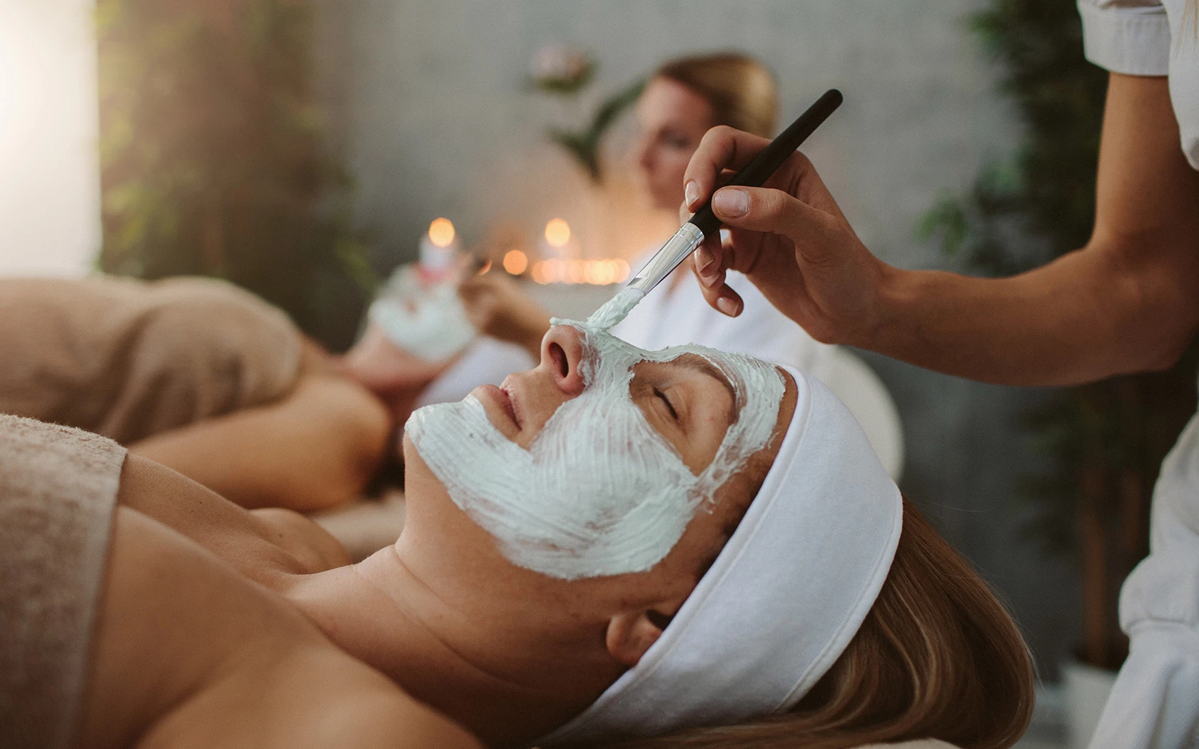 two ladies relaxing with a facial