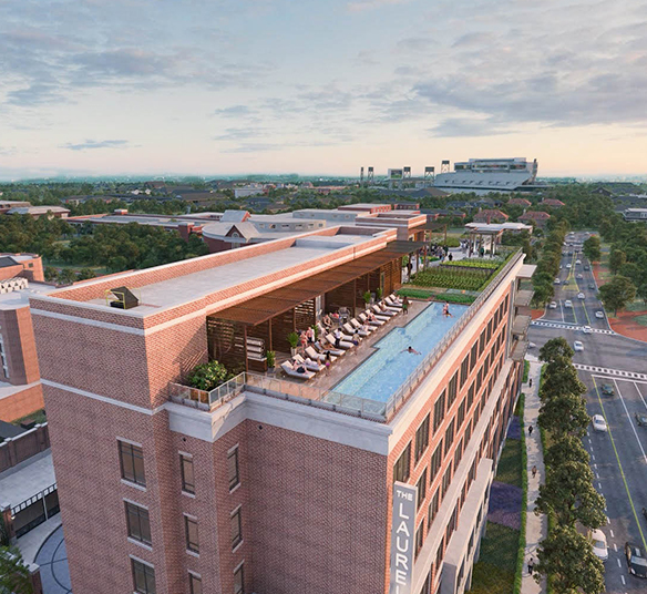 view of the rooftop pool and bar on the hotel building