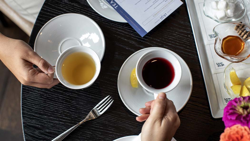 a person holding a cup of coffee