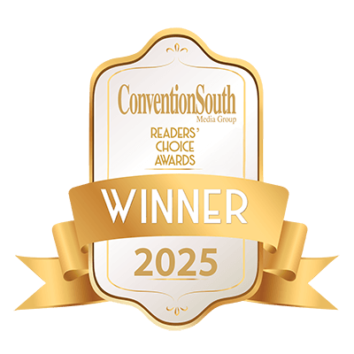 a white and gold label with a gold ribbon