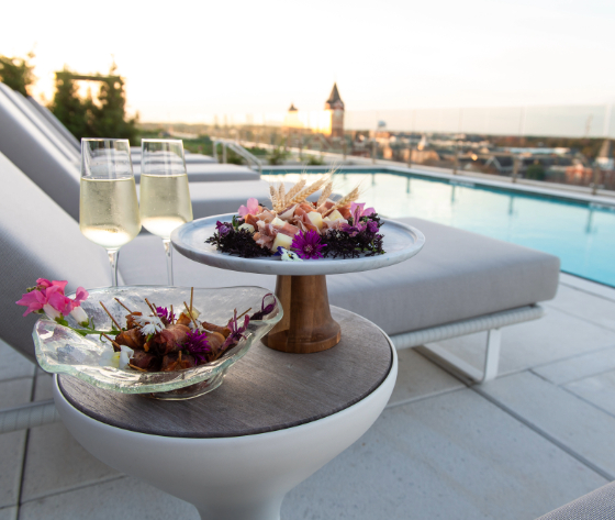 a table with food and glasses of champagne on it