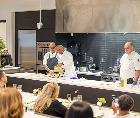 a group of chefs in a kitchen