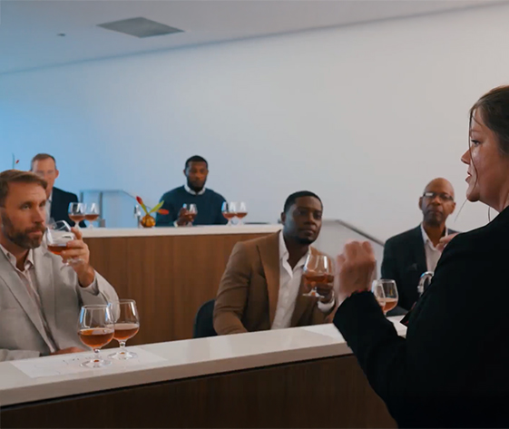 a group of men sitting at a bar