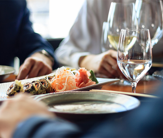 a group of people eating at a restaurant