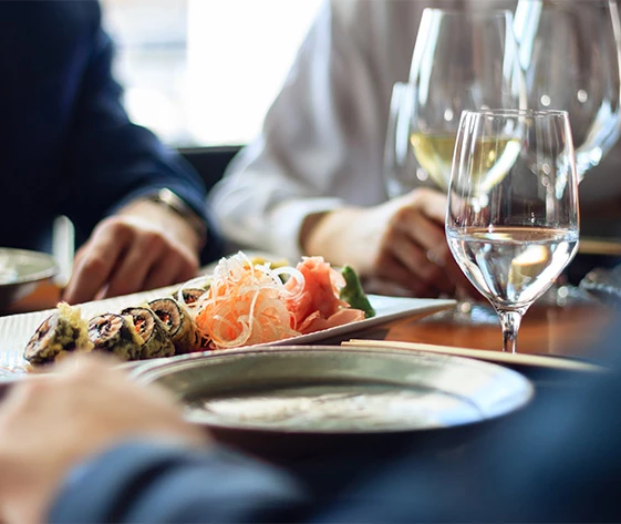 a group of people eating at a restaurant