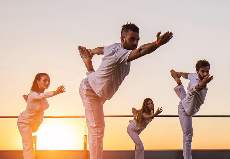 a group of people doing yoga