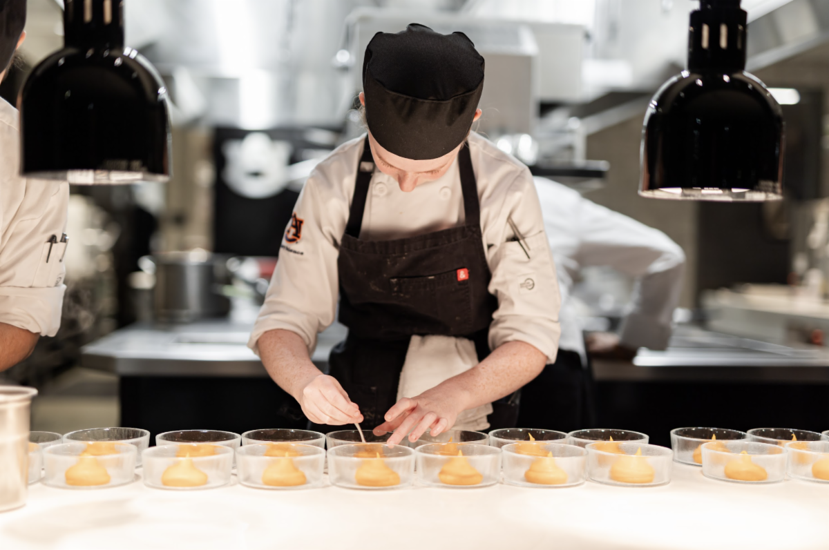 a chef preparing food in a kitchen