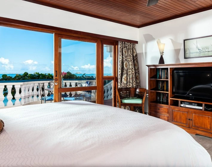 a bedroom with a large window