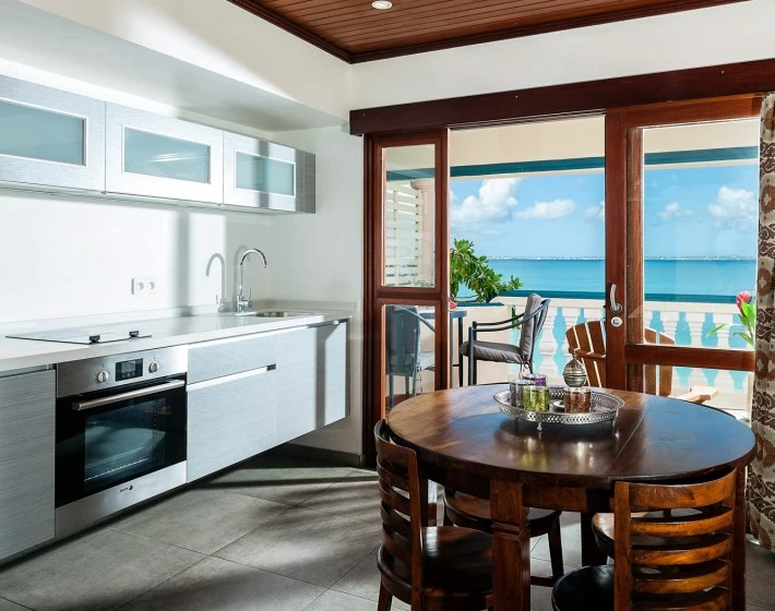 a kitchen with a table and chairs