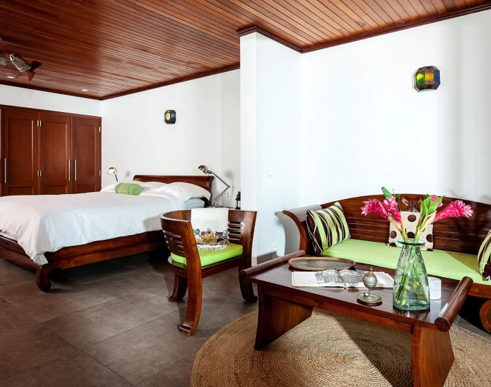 a bedroom with a bed and a table