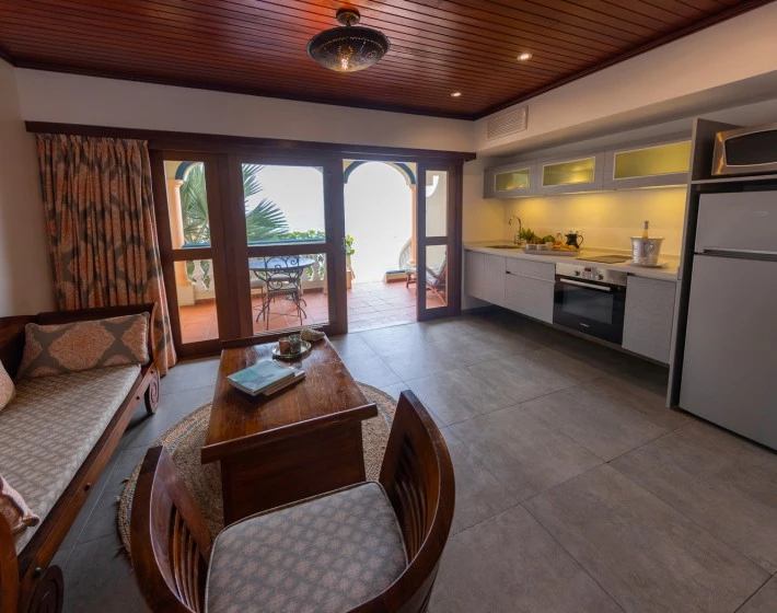 a living room with a table and chairs
