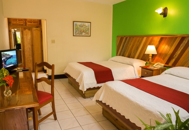 spacious open and airy bedroom with 2 queen beds