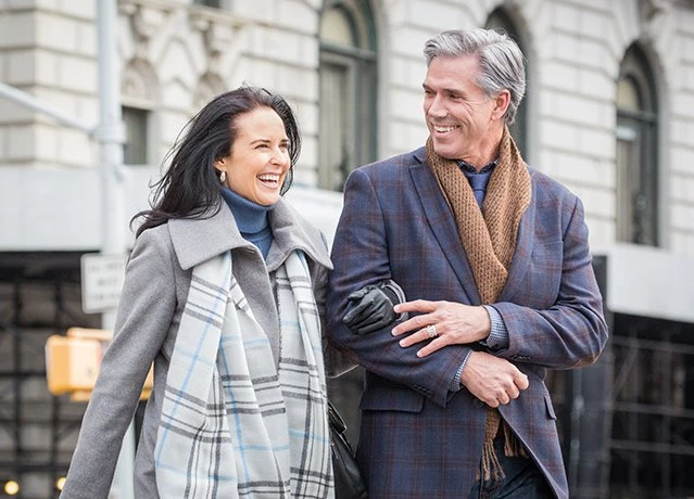 older couple walking hand in hand on the streets of new york city