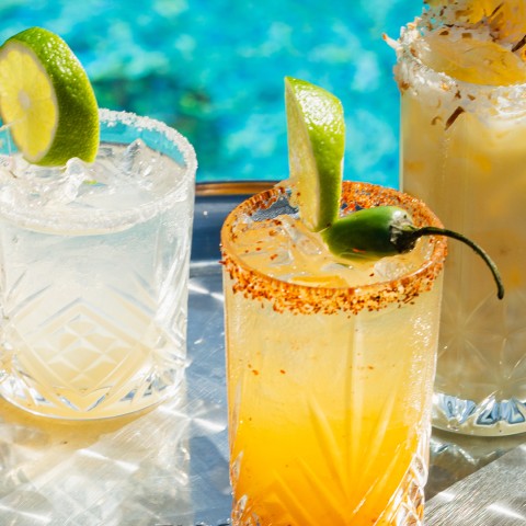 a group of drinks on a tray