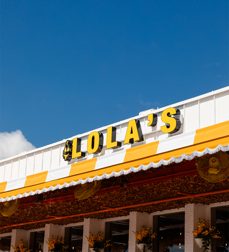 a yellow and white awning on a building