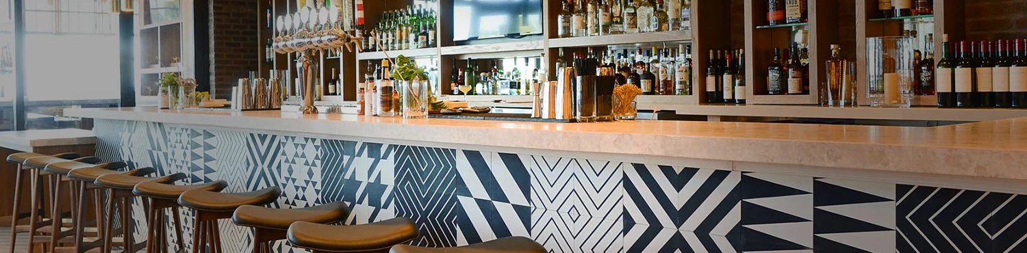Bar with barstools at Lona