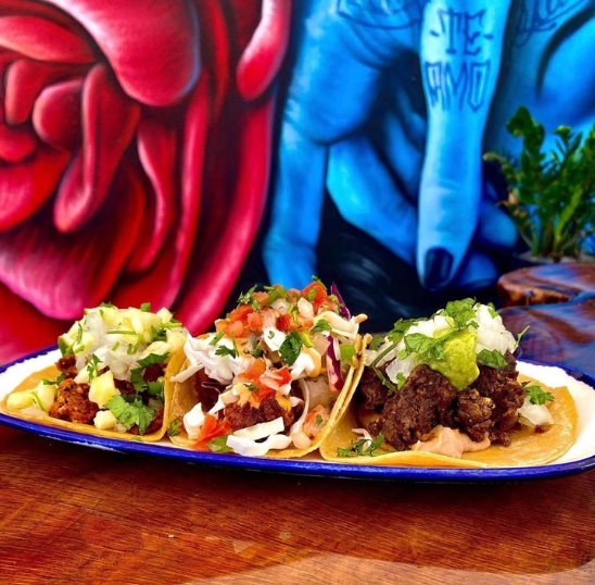 a plate of tacos on a table
