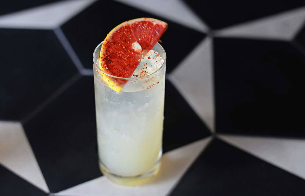 white cocktail with grapefruit slice