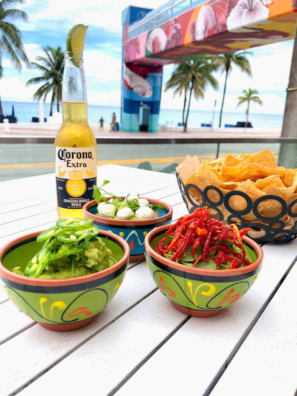 Guac with chips and Corona beer