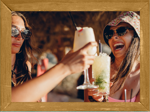 a group of women holding drinks